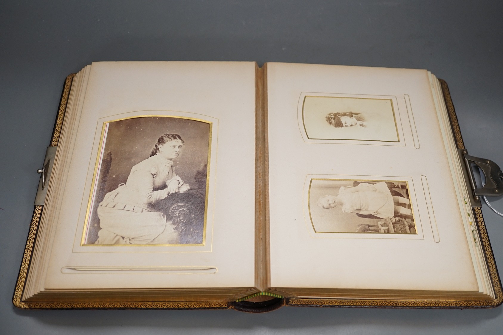 A late Victorian Morocco leather album of cabinet card photo portraits